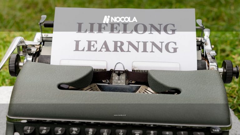 Close-up of a typewriter typing 'Lifelong Learning' outdoors, symbolizing continuous knowledge growth.