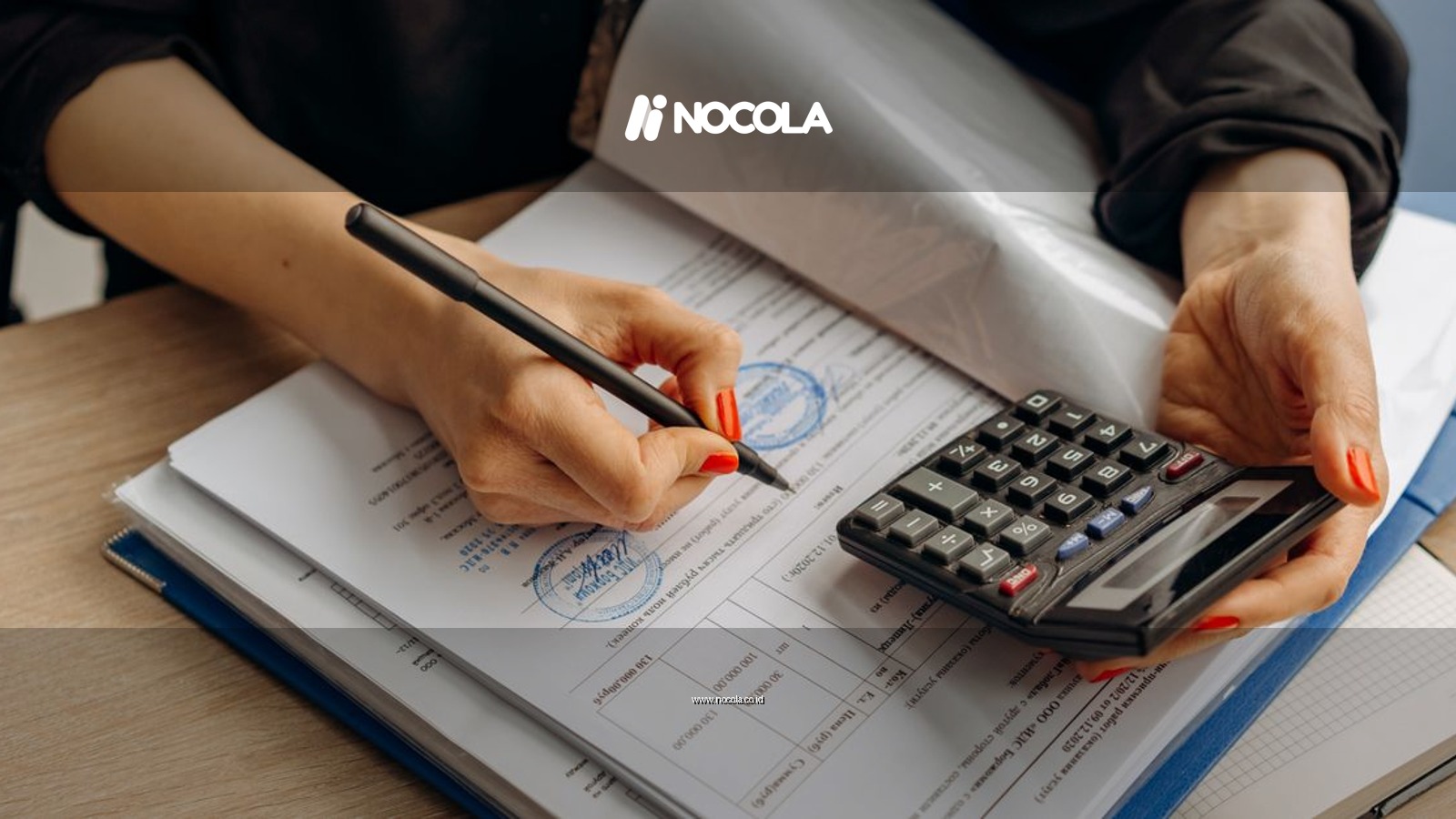 An accountant using a calculator and signing paperwork, showcasing financial analysis.