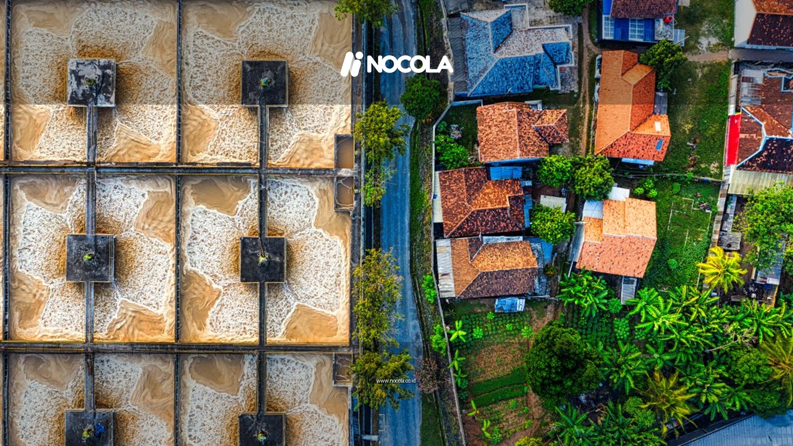 Aerial photograph depicting an industrial plant next to a residential neighborhood in Indonesia.