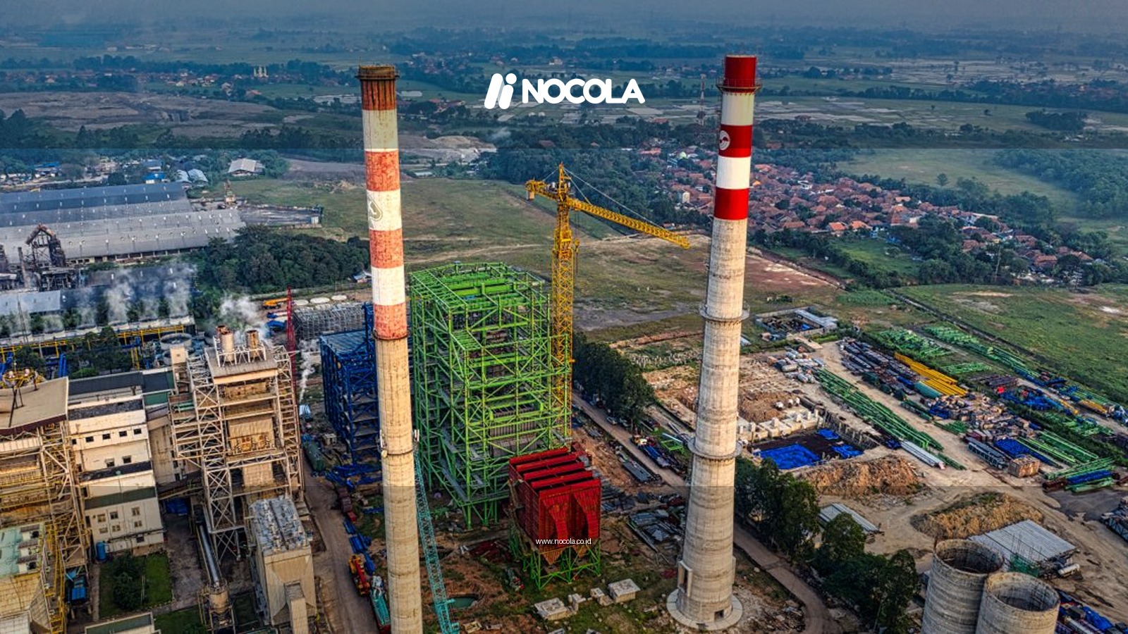 Aerial view of industrial manufacturing plant with chimneys and machinery in Serang, Indonesia.