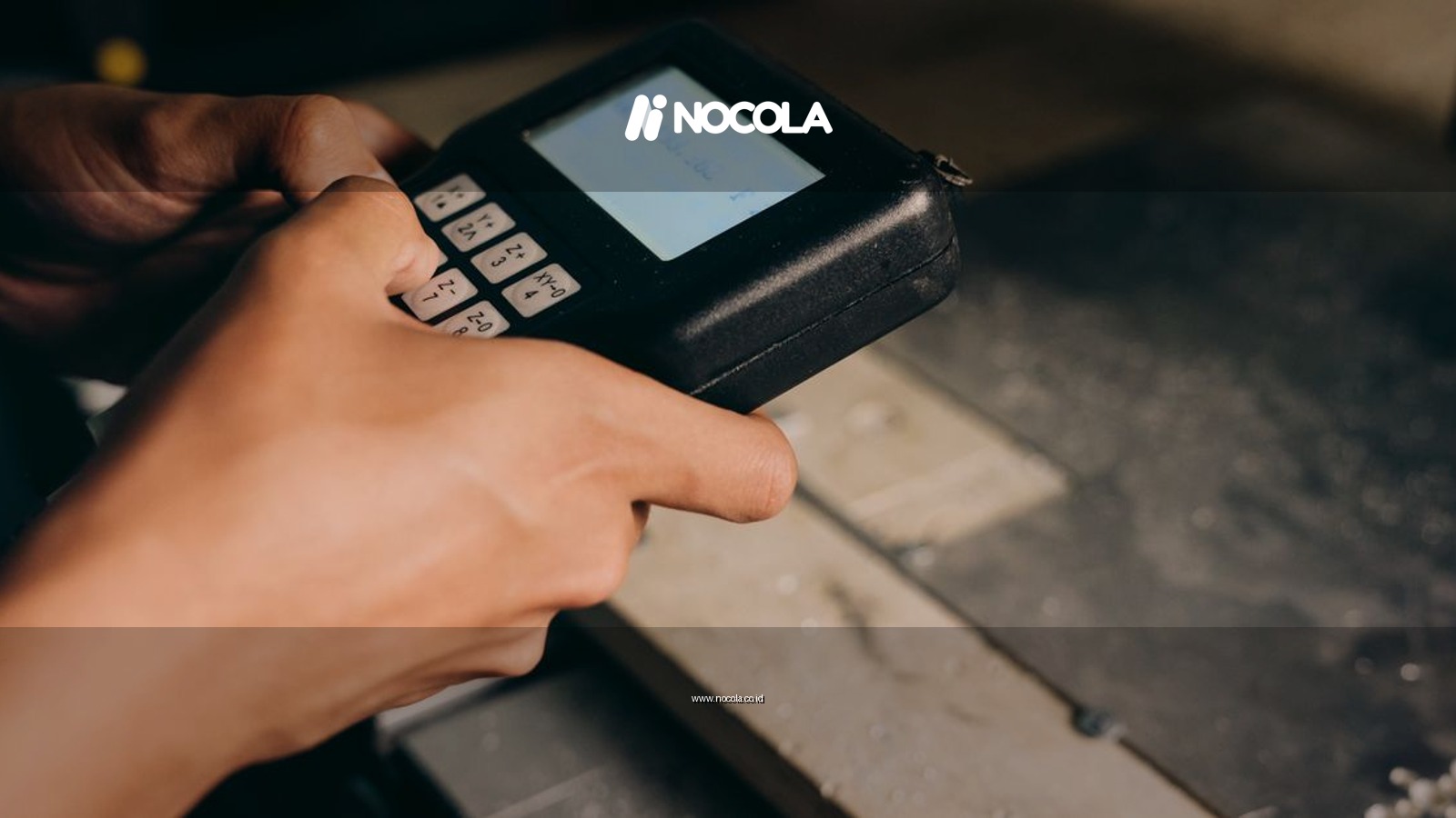 A detailed close-up of hands operating an electronic control device, capturing the precision of modern technology use.
