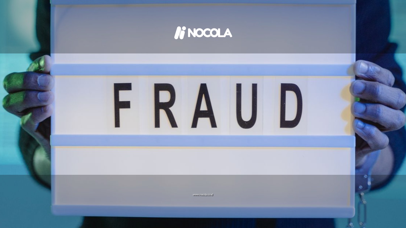 Close-up of hands holding a sign with 'fraud', illuminated in blue light.